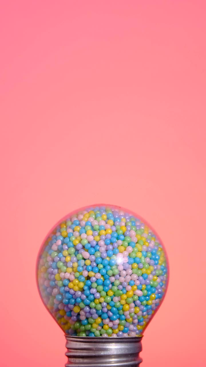 Free Stock Video Round Spotlight That Glows Full Of Colorful Candies On A Live Wallpaper
