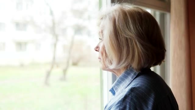 Free Stock Video Sad Woman Looking Out Of A Large Window Live Wallpaper