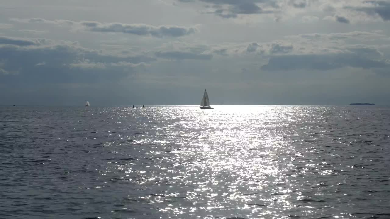 Free Stock Video Sailboat Heading Over A Calm Sea Live Wallpaper