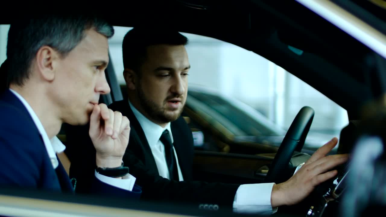 Free Stock Video Salesman Showing New Car To Client Live Wallpaper