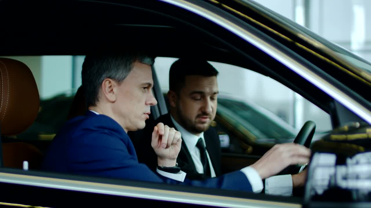 Free Stock Video Salesman Showing The Car To A Client Live Wallpaper
