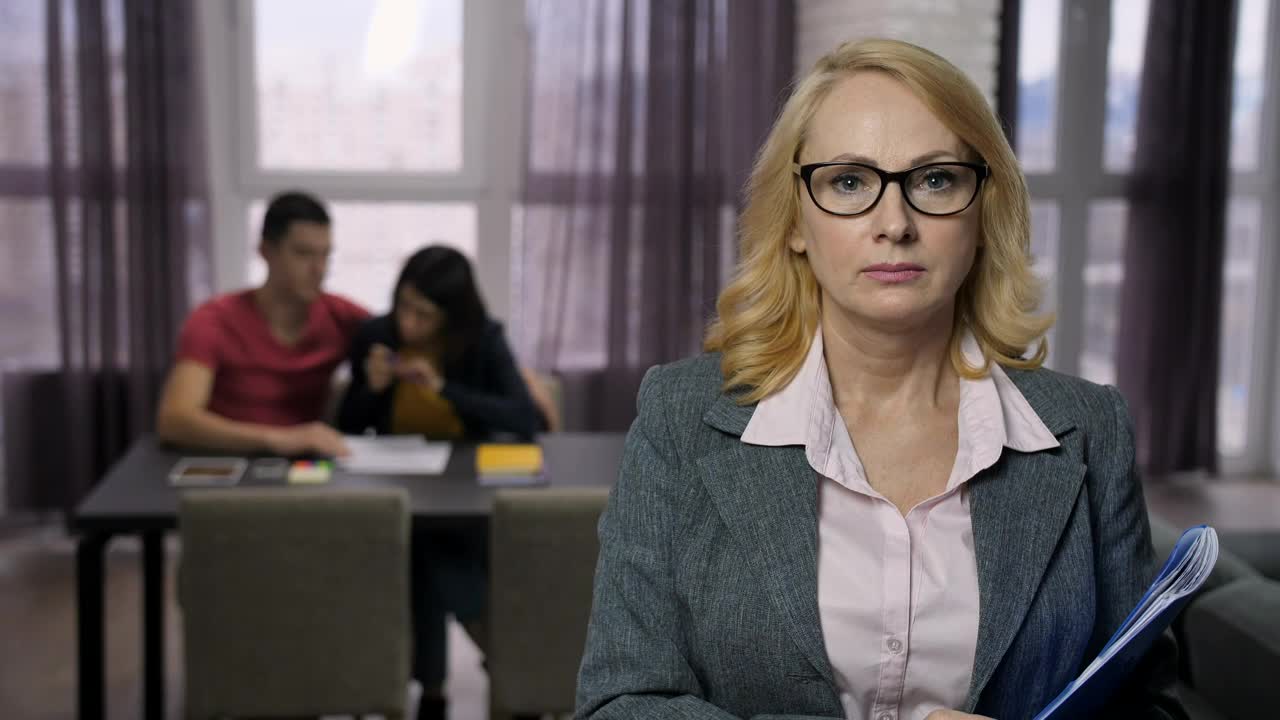 Free Stock Video Saleswoman Smiling While A Couple Signs A Contract Live Wallpaper