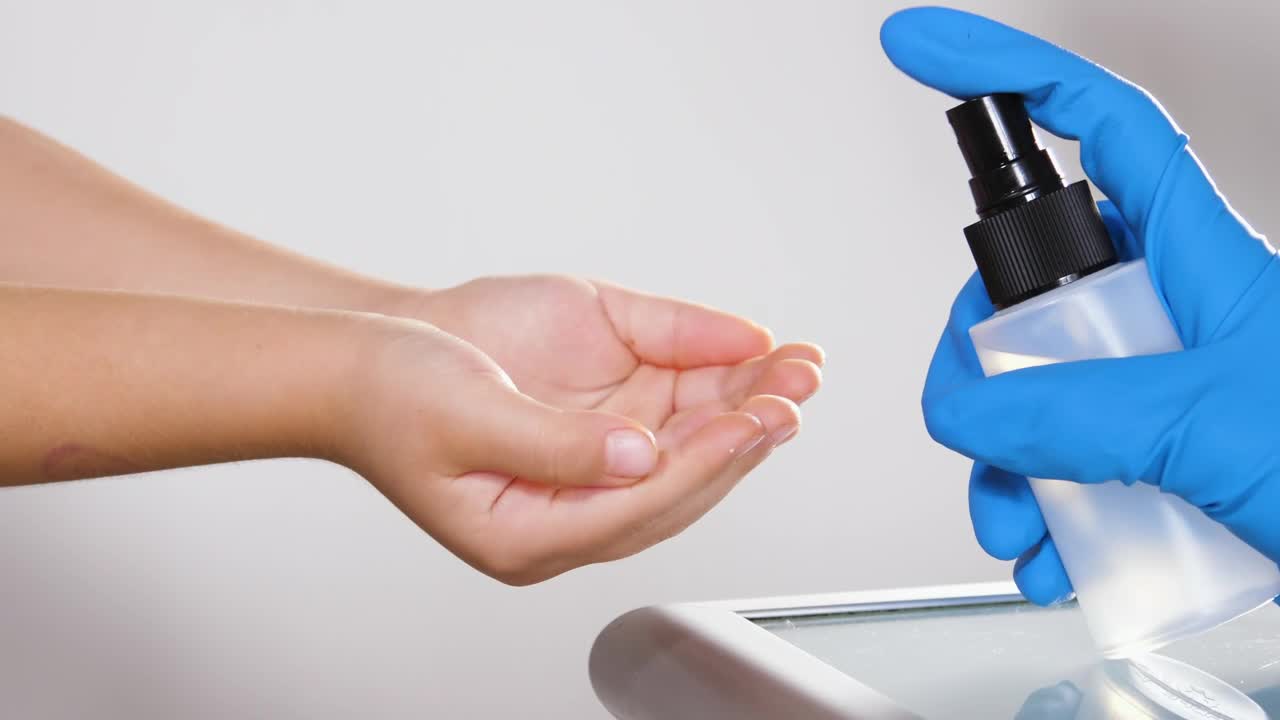Free Stock Video Sanitizing Children Hands With Sprayer Live Wallpaper