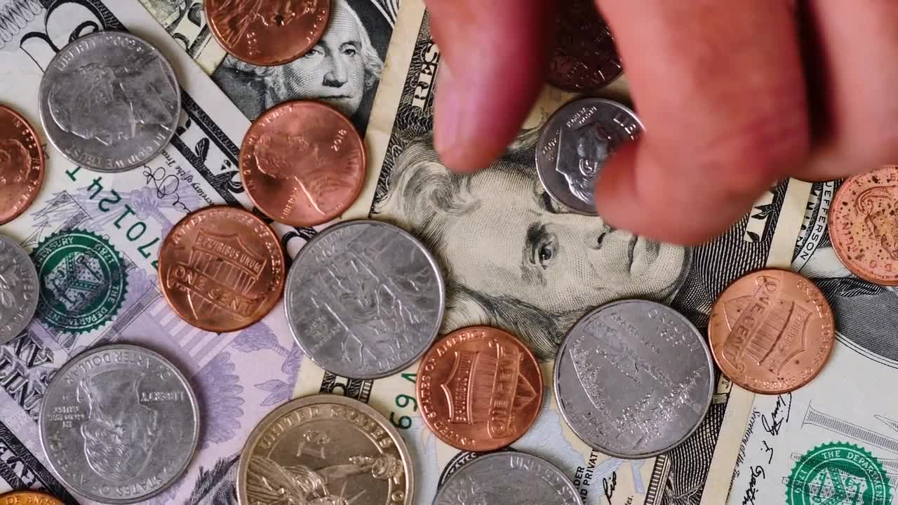 Free Stock Video Scene Covered In Bills And Coins As A Person Takes Live Wallpaper