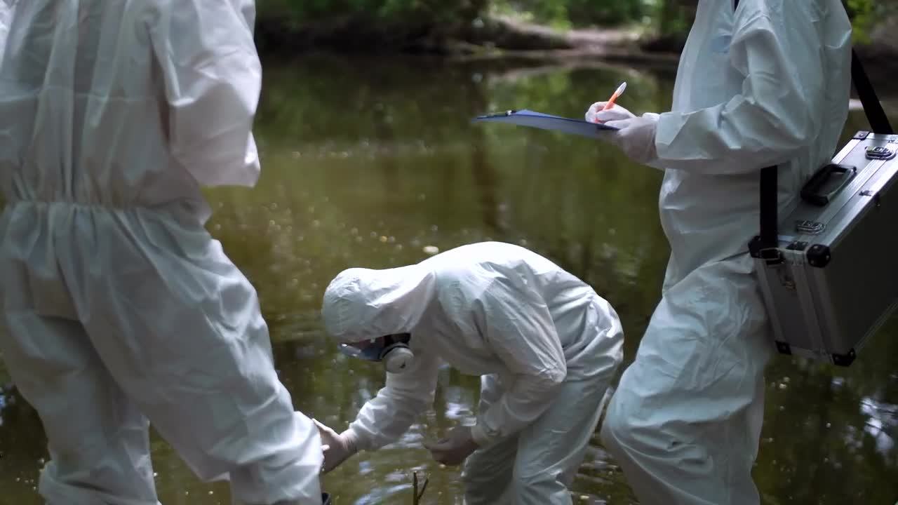 Free Stock Video Scientist In Biohazard Suits Collecting Water Live Wallpaper