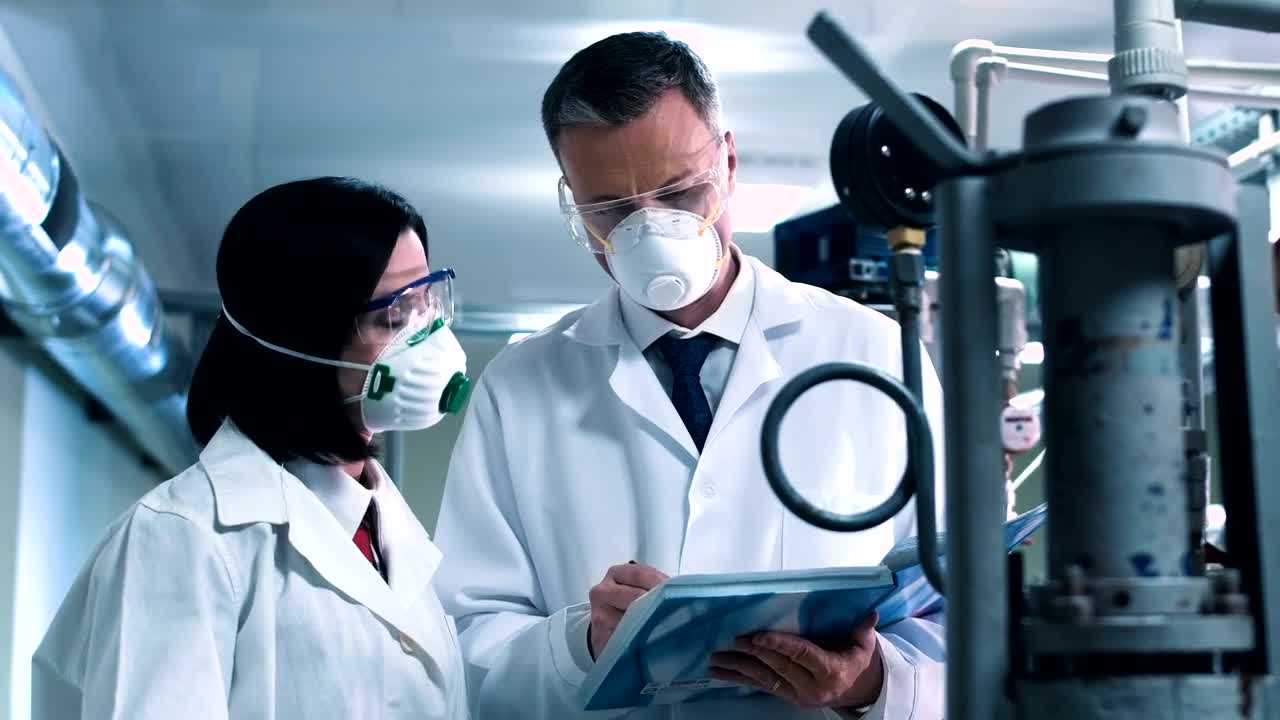 Free Stock Video Scientist Taking Notes From Lab Equipment Live Wallpaper