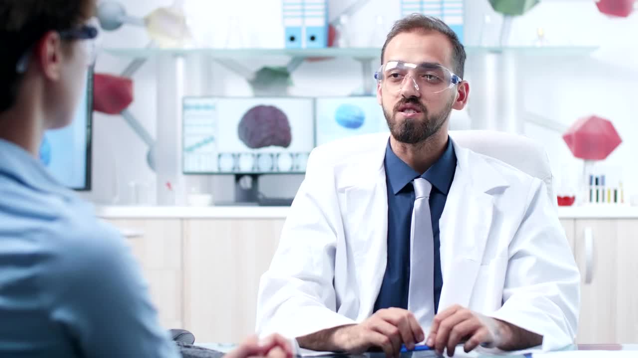 Free Stock Video Scientist Uses Ar Innovation To Show Data To Colleague Live Wallpaper