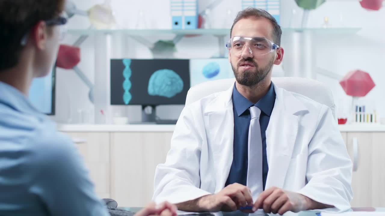 Free Stock Video Scientist Uses Innovative Ar Tech While Talking To Colleague Live Wallpaper