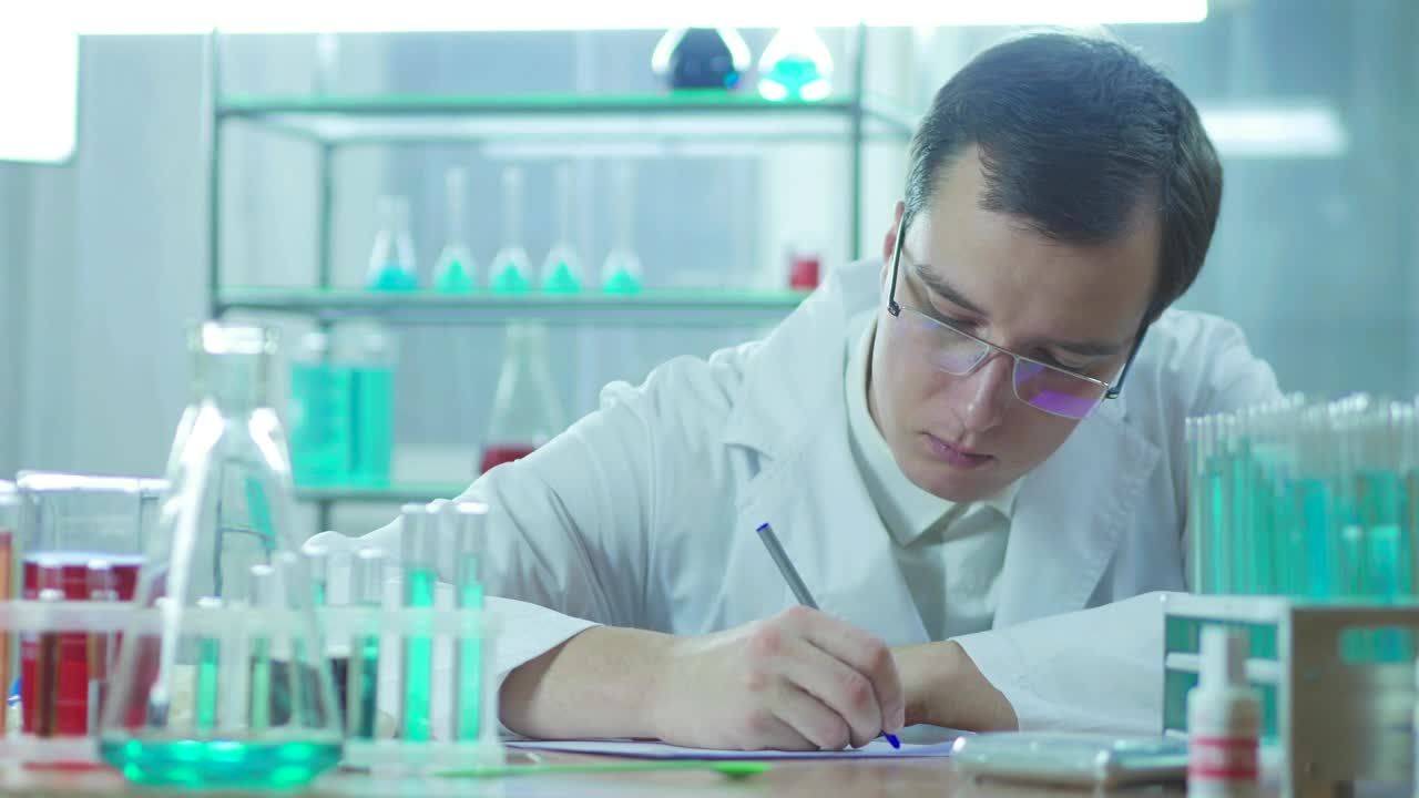 Free Stock Video Scientist Writing In The Lab Live Wallpaper
