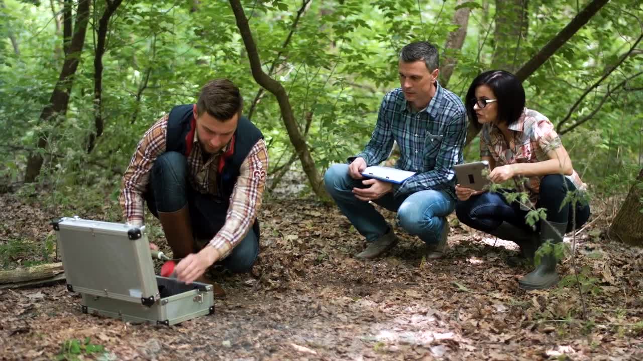 Free Stock Video Scientists Picking Up Ground Samples Live Wallpaper