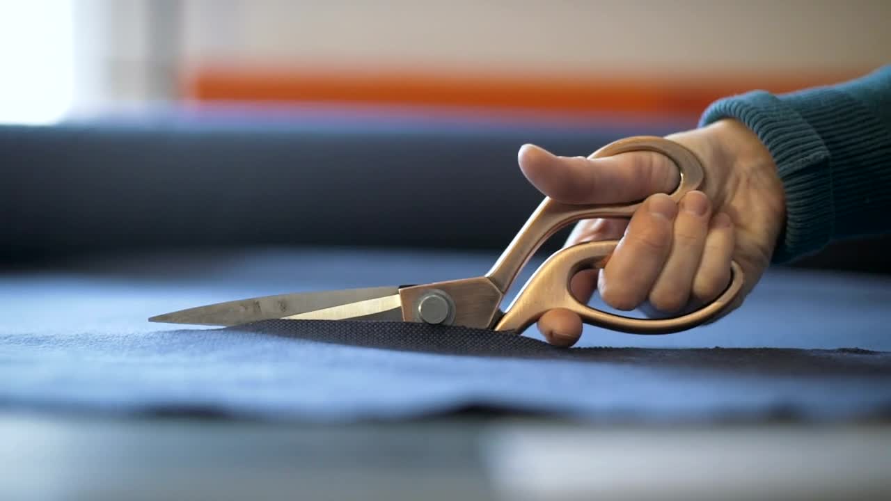 Free Stock Video Scissors Cutting A Blue Fabric Live Wallpaper