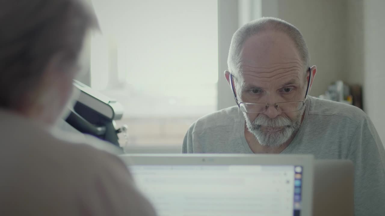 Free Stock Video Senior Man Reading Information On The Computer Live Wallpaper