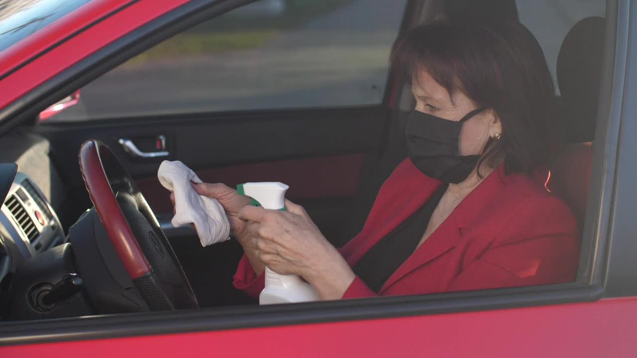 Free Stock Video Senior Woman Disinfecting The Steering Wheel Live Wallpaper