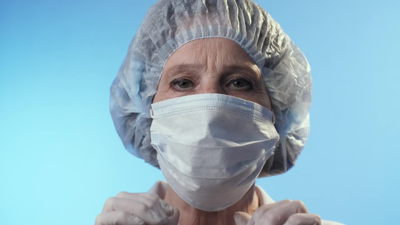 Free Stock Video Serious Doctor Takes Off Mask Portrait Live Wallpaper