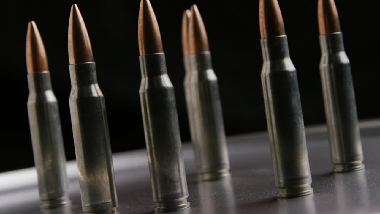 Free Stock Video Several Bullets Rotating On A Metal Plate Live Wallpaper