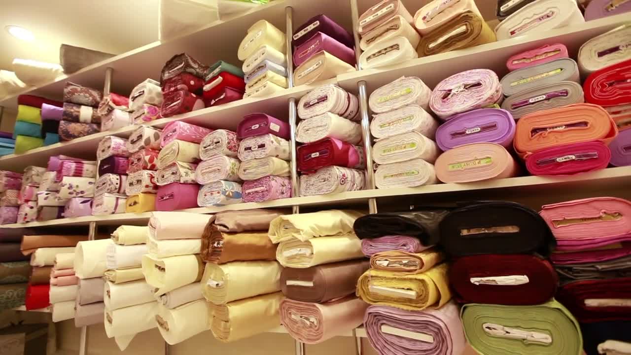 Free Stock Video Shelf Full Of Fabric Rolls In A Store Live Wallpaper