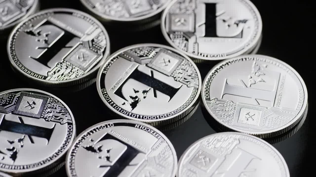 Free Stock Video Shiny Lite Coins Rotating On A Black Surface Live Wallpaper