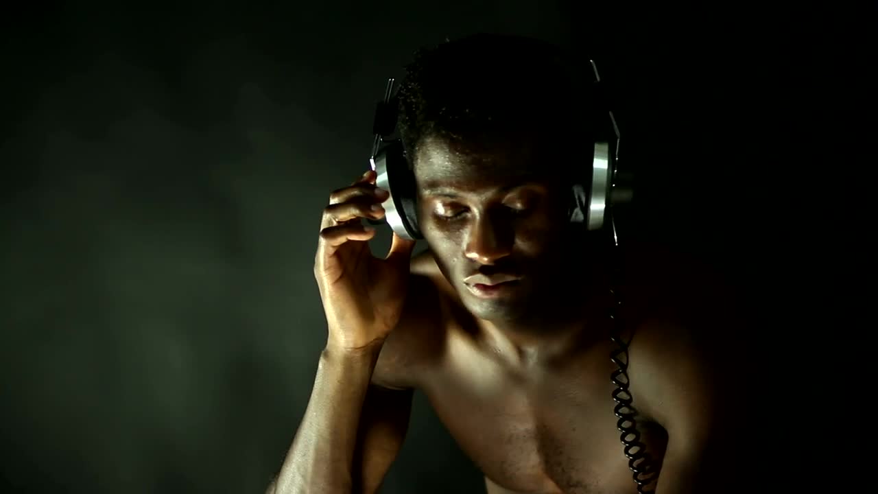 Free Stock Video Shirtless Man Listening To Music With Retro Headphones Live Wallpaper