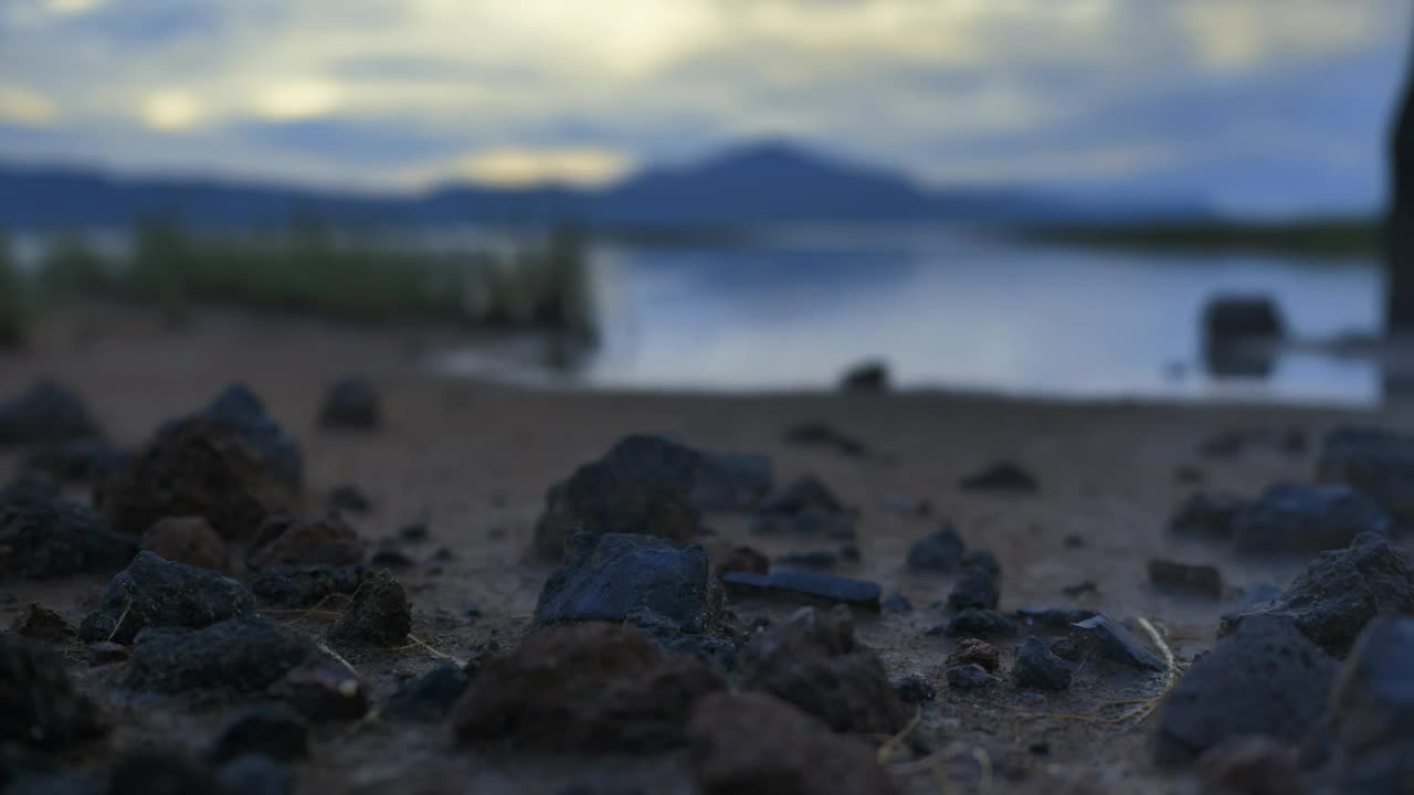 Free Stock Video Shore Of A Calm Lake With Sand Grass And Rocks Live Wallpaper