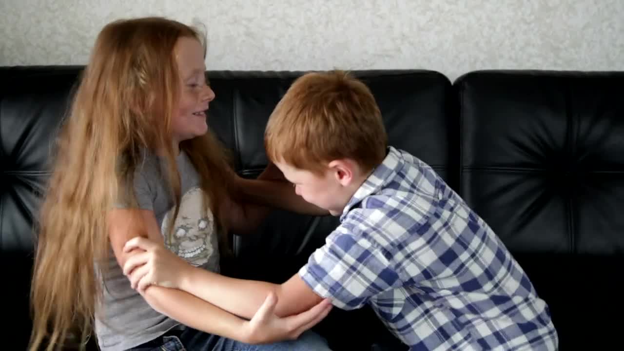Free Stock Video Siblings Play Fighting At Home Live Wallpaper