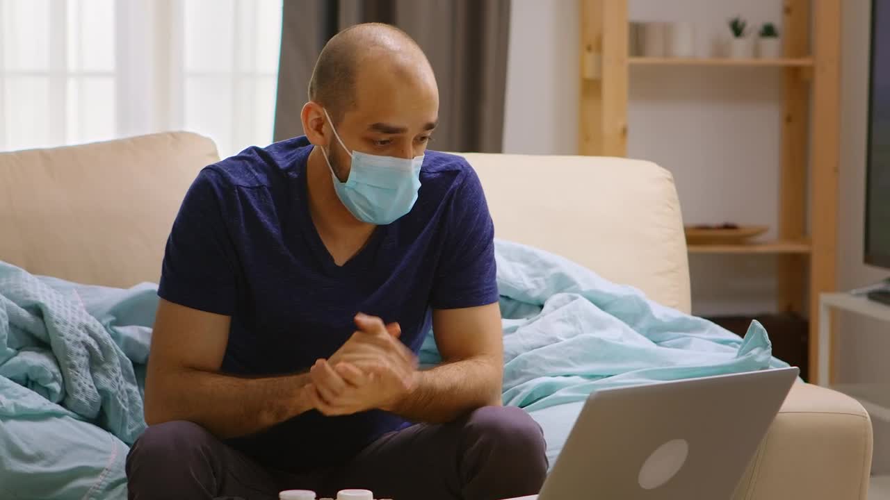 Free Stock Video Sick Man Chats On Video Call From Couch At Home Live Wallpaper