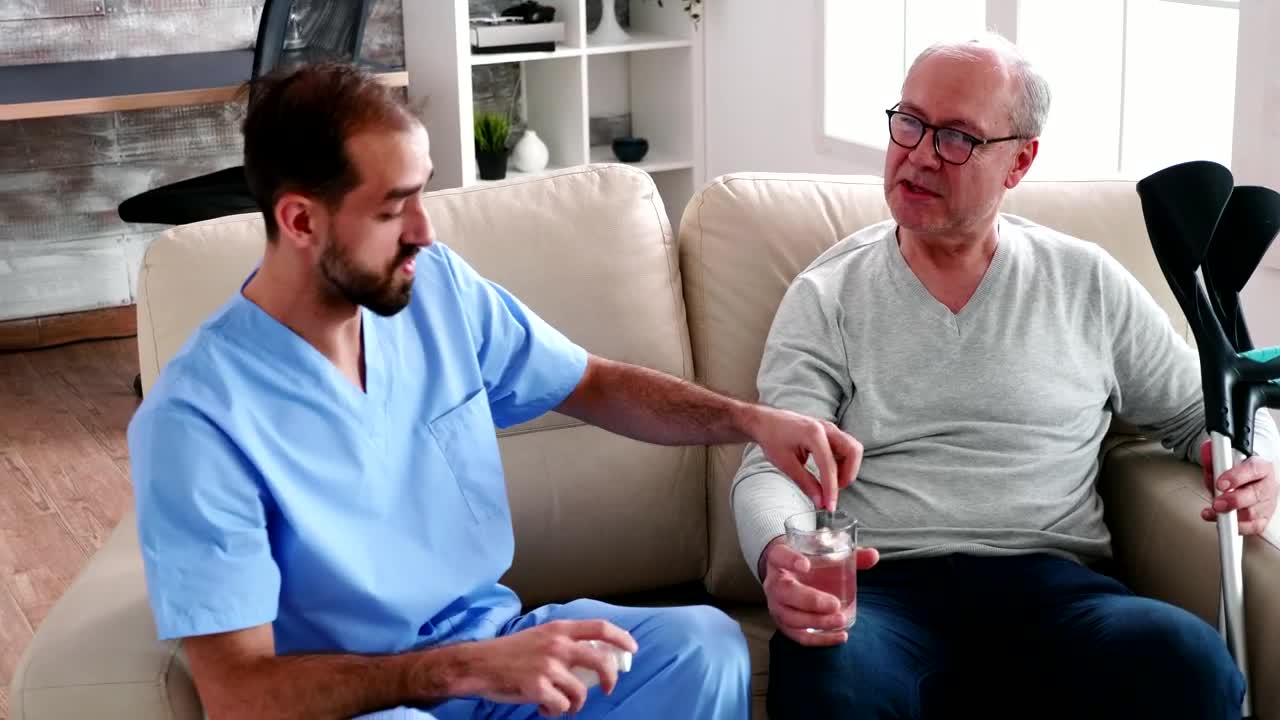 Free Stock Video Sick Man Chats With Nurse Giving Him Medication Live Wallpaper