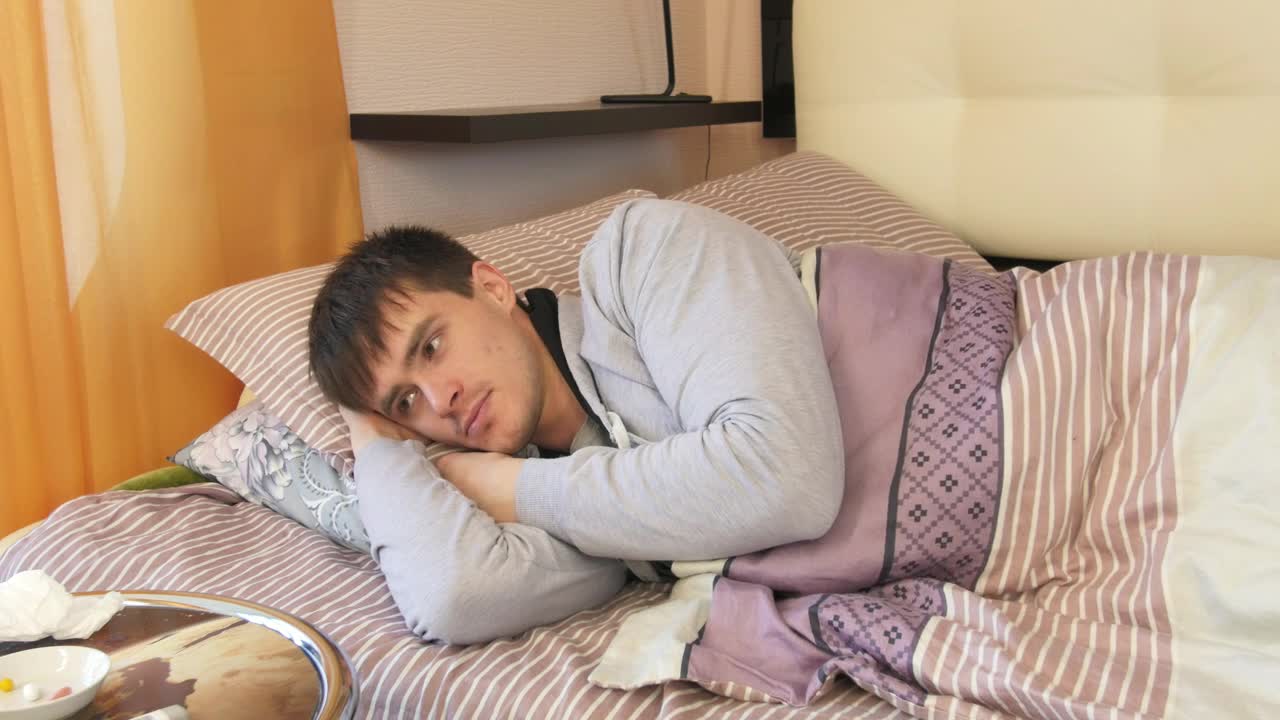 Free Stock Video Sick Man Laying In Bed During The Day Live Wallpaper