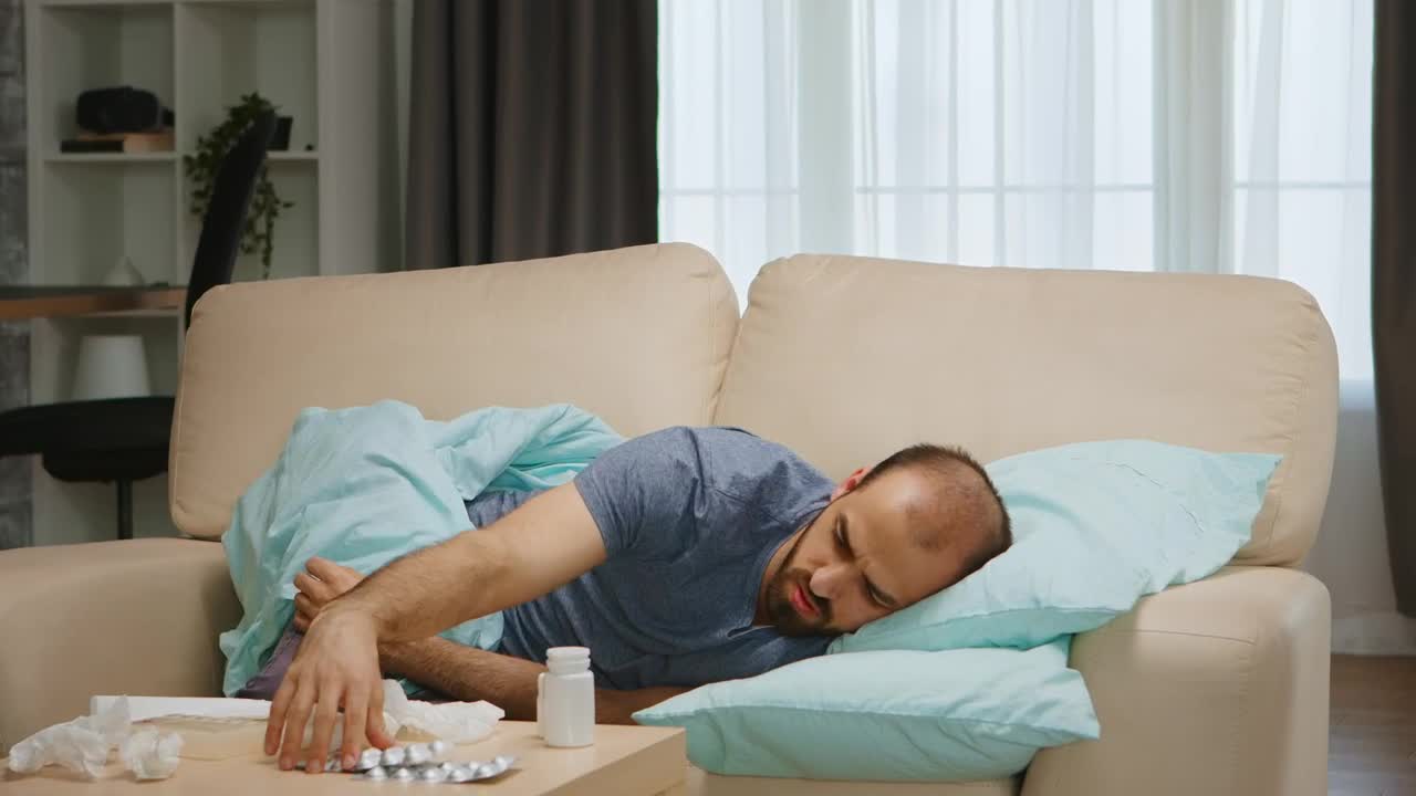 Free Stock Video Sick Man Lays On Sofa And Looks At Medication Live Wallpaper