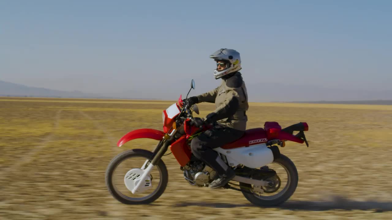 Free Stock Video Side Shot Of A Biker In The Desert Live Wallpaper
