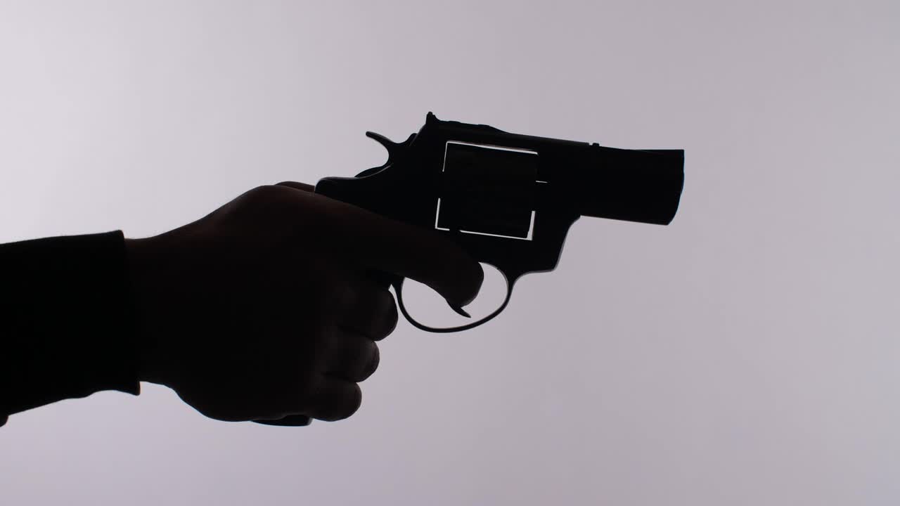 Free Stock Video Silhouette Of A Hand Firing A Revolver Live Wallpaper