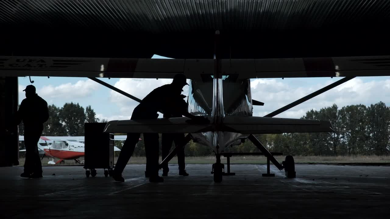 Free Stock Video Silhouette Of A Man Polishing A Biplane Live Wallpaper
