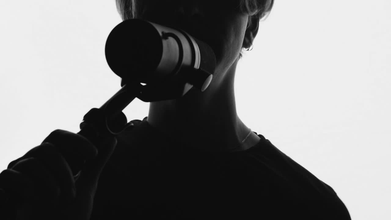 Free Stock Video Silhouette Of A Man Singing On A White Background Live Wallpaper