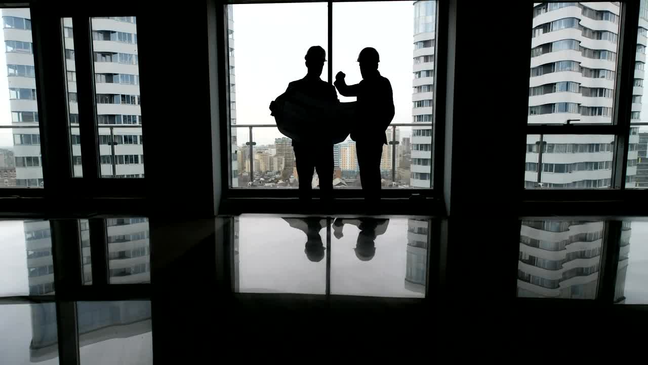 Free Stock Video Silhouette Of Construction Labourers Looking At Skyscraper Plans Live Wallpaper