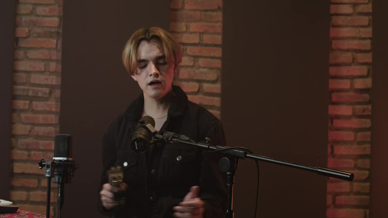 Free Stock Video Singer Recording Vocals In A Studio With A Tambourine Live Wallpaper