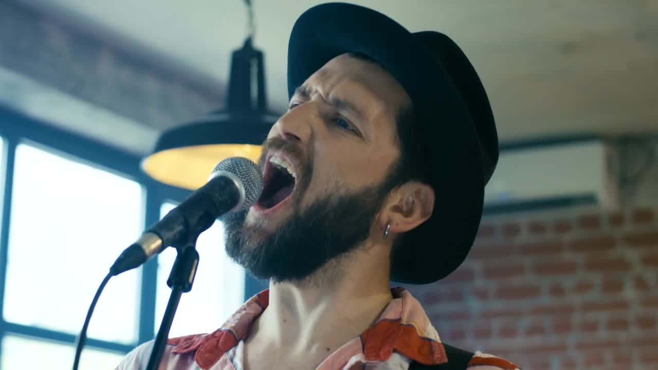 Free Stock Video Singing In A Hat With A Microphone Live Wallpaper