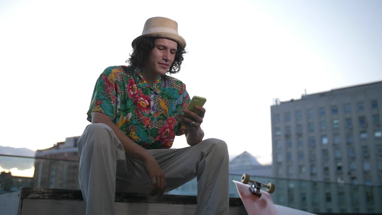 Free Video Stock Skater Using His Phone In The City Live Wallpaper