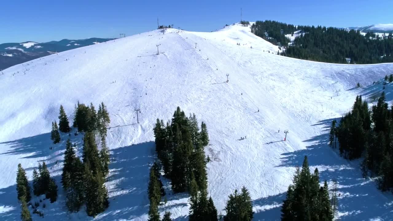 Free Video Stock Ski Area On A Snowy Mountain With Few Trees Live Wallpaper