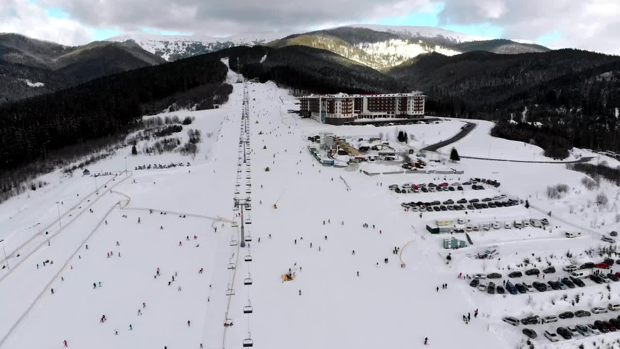 Free Video Stock Ski Resort And Skiers Going Down The Mountain Live Wallpaper