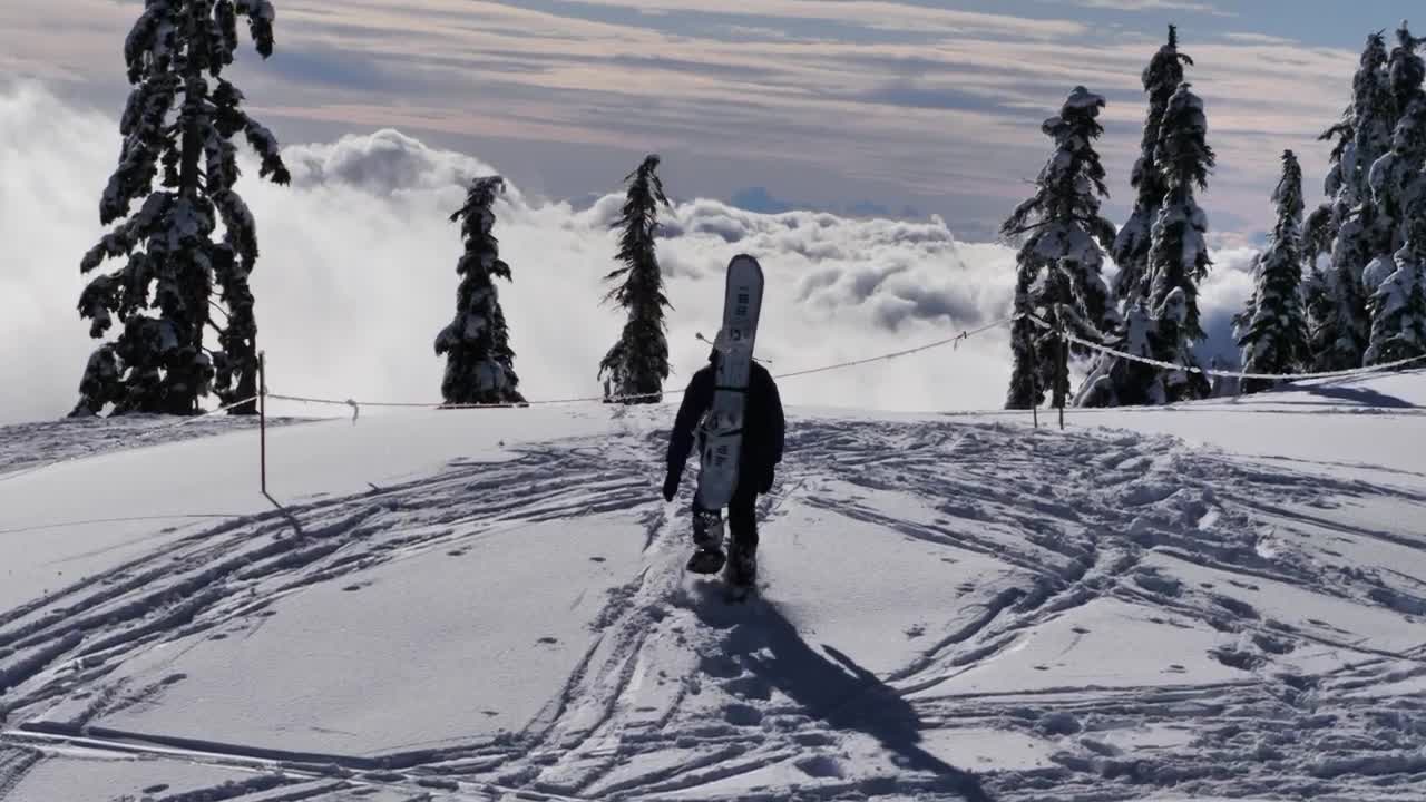 Free Video Stock Skier At The Peak Of A Snowy Mountain Live Wallpaper