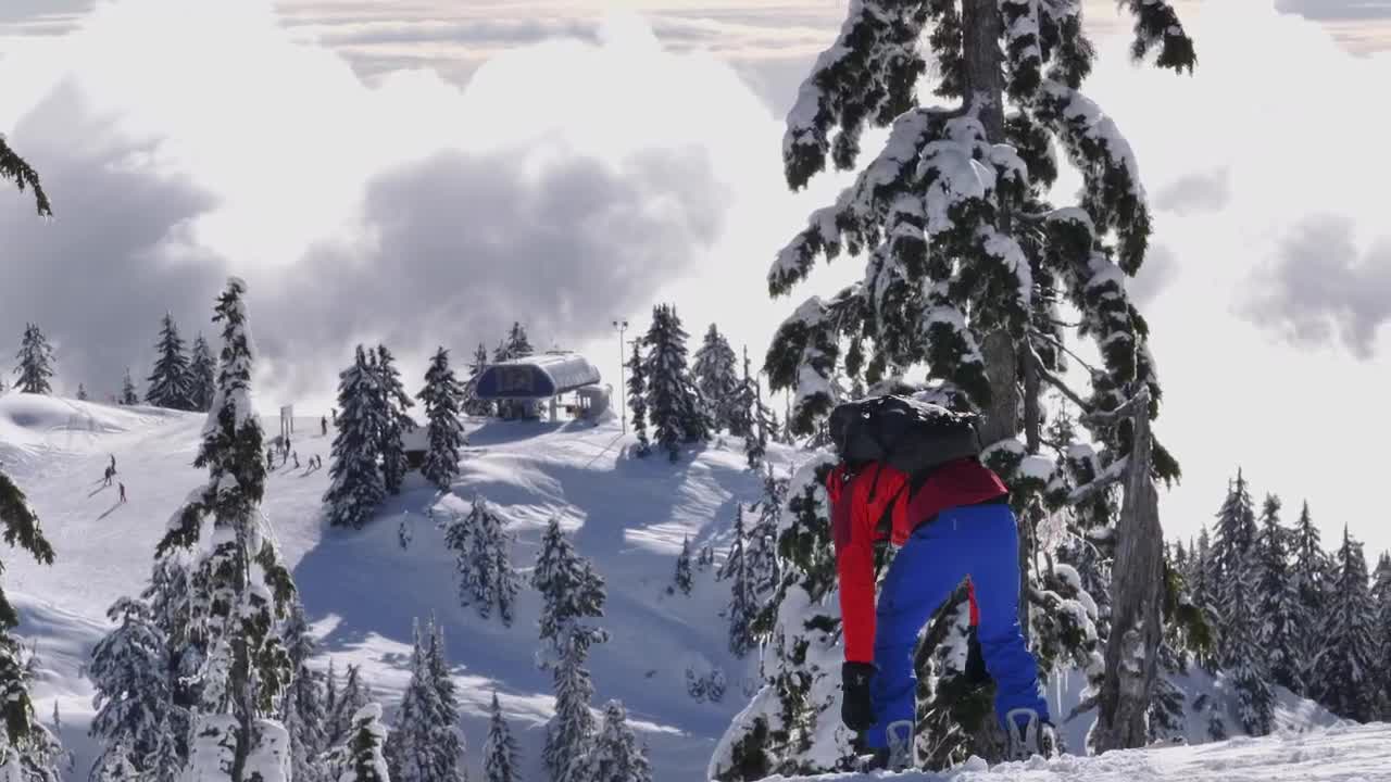 Free Video Stock Skier Fitting A Boot On Top Of A Mountain Live Wallpaper