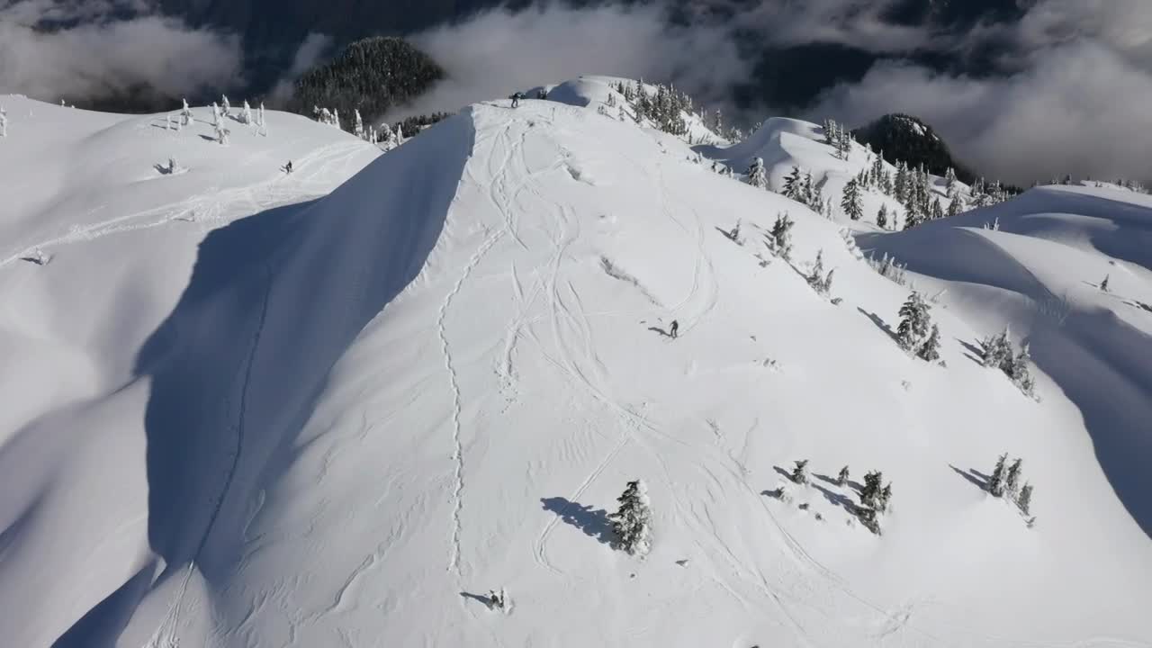 Free Video Stock Skiers Going Down A Canadian Mountain Live Wallpaper