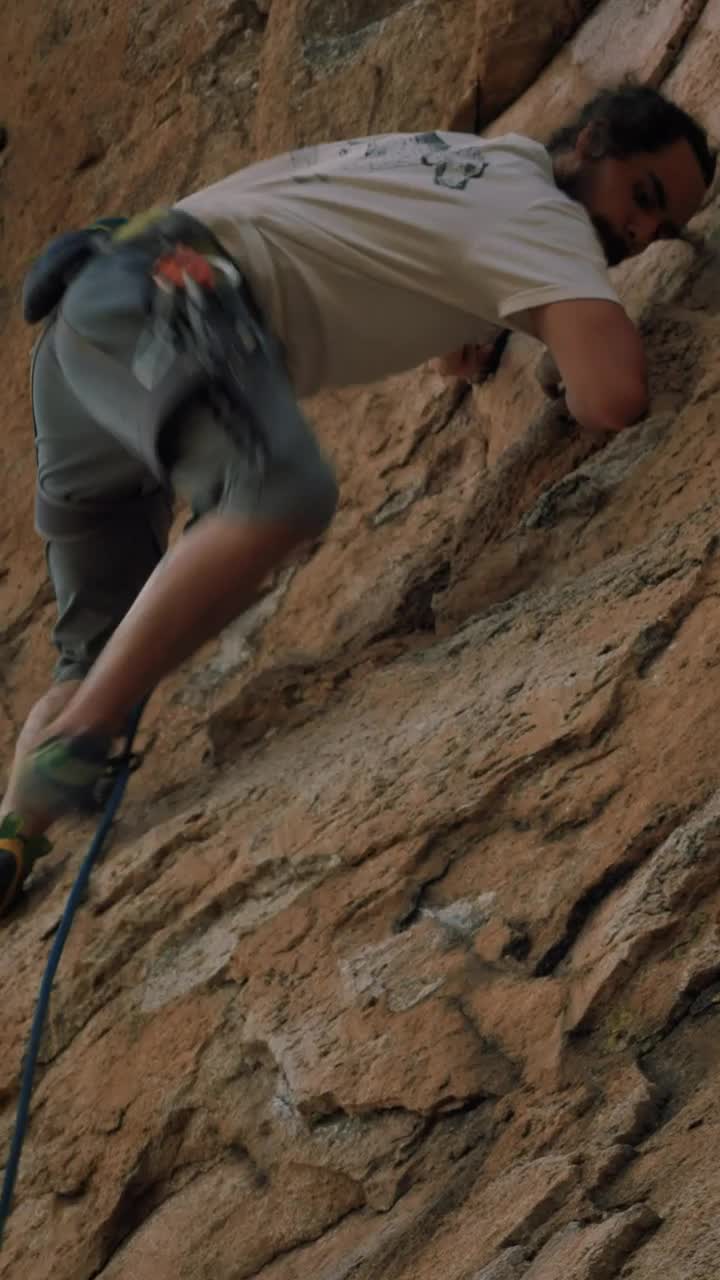 Free Video Stock Skilled And Experienced Mountaineer Climbing A Rocky Mountain Live Wallpaper