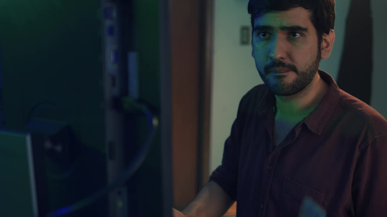 Free Video Stock Skilled Programmer Working In Front Of A Computer Live Wallpaper