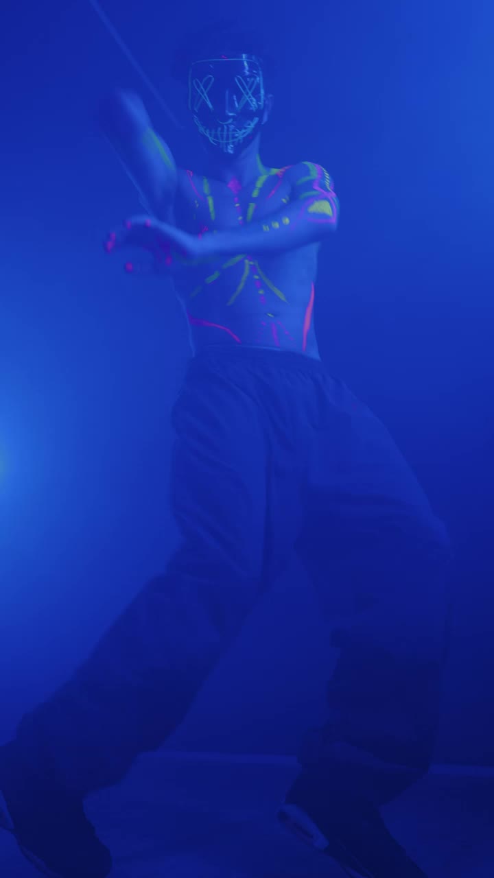 Free Video Stock Skillful Boy Dancing With A Mask With Lights Live Wallpaper