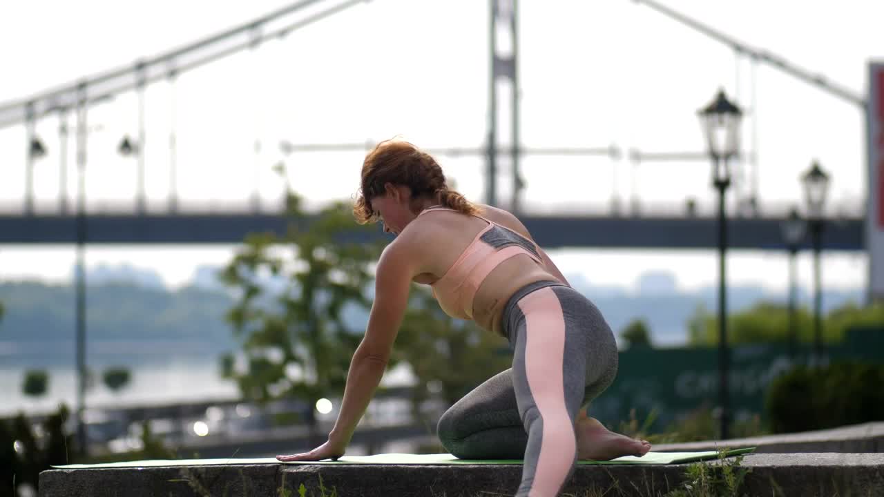 Free Video Stock Skillful Woman Doing A Complex Yoga Pose Live Wallpaper