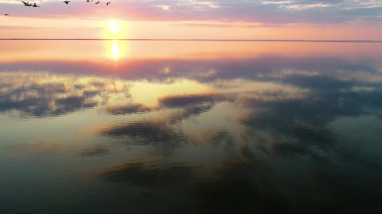 Free Video Stock Skyline At Sunset Reflected In The Sea Live Wallpaper