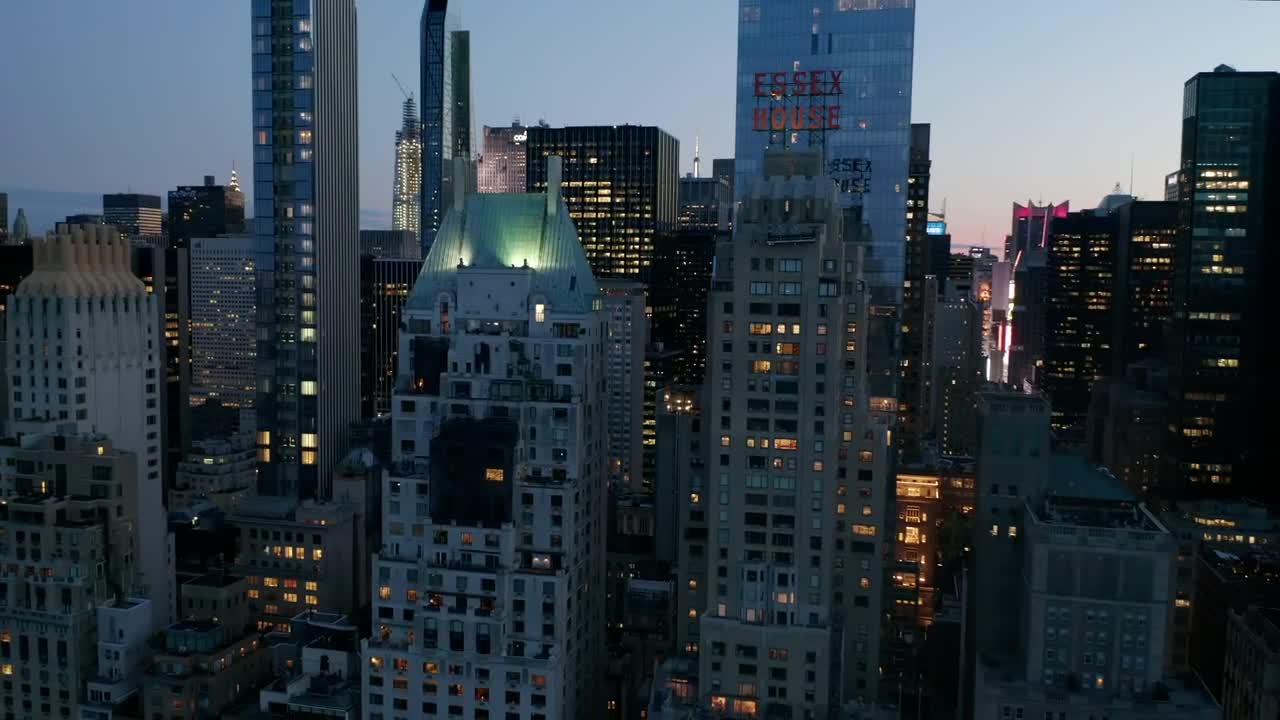 Free Video Stock Skyscrapers At Dusk Front Aerial View Live Wallpaper
