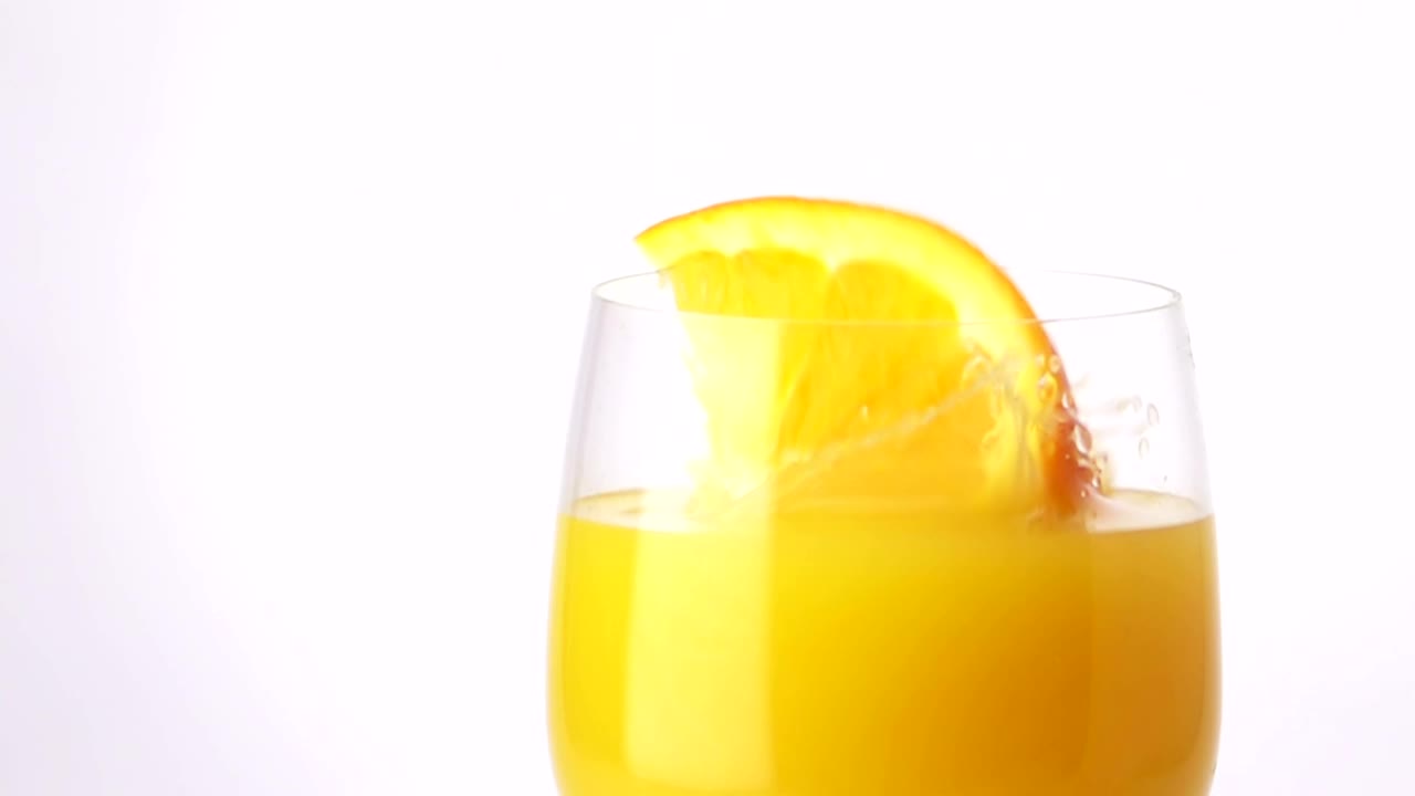 Free Video Stock Slice Of Orange Falling Into The Juice Live Wallpaper