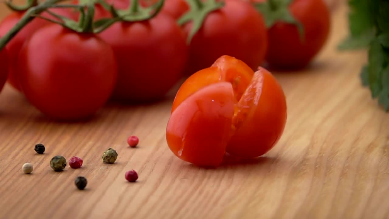 Free Video Stock Sliced Tomato Falls On A Wooden Board Live Wallpaper