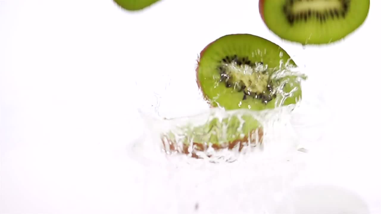 Free Video Stock Slices Of Kiwi Falling Into Water Live Wallpaper